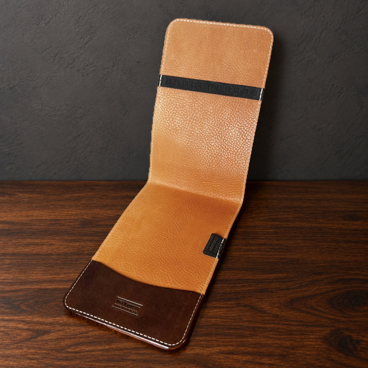 Augusta Classic yardage book cover in Nemesis standing open, showing the natural interior