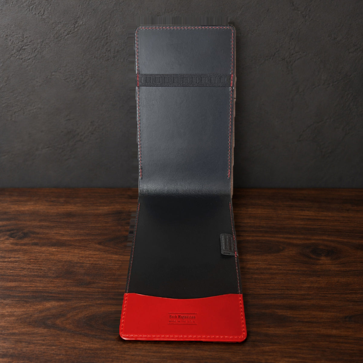 Inside the Augusta Pro yardage book cover: black interior, a top elastic, a full-length pocket and a pencil loop