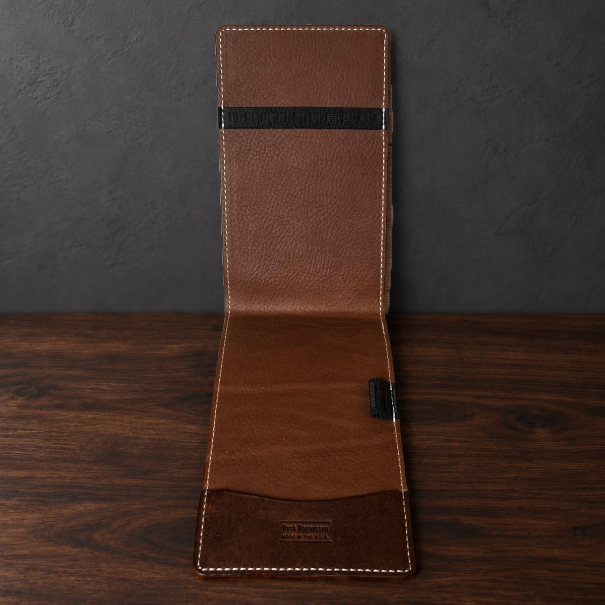 Inside the Augusta Pro yardage book cover: whiskey interior, a top elastic, a full-length pocket and a pencil loop
