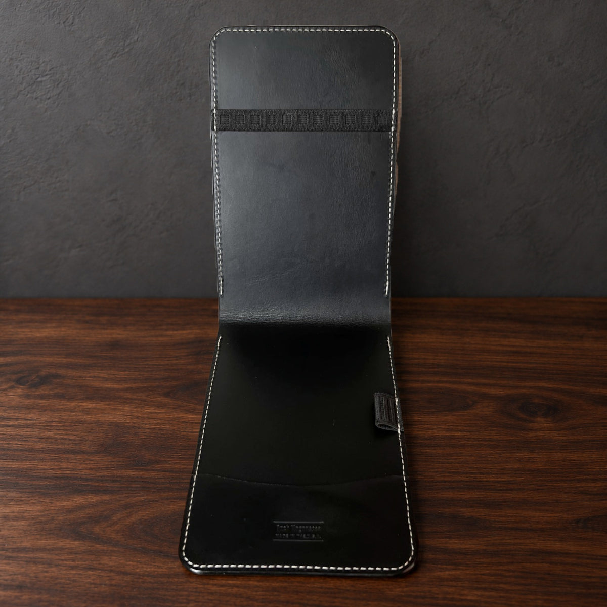 Inside the Augusta Pro yardage book cover: black interior, a top elastic, a full-length pocket and a pencil loop