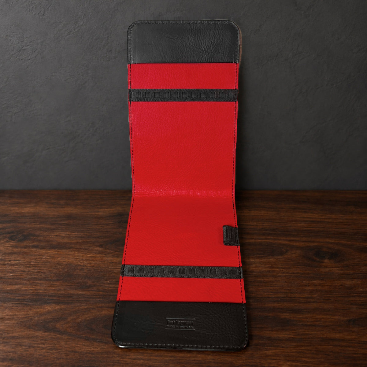 Inside the Oakmont Classic yardage book cover: red interior, elastics at the top and bottom and a pencil loop