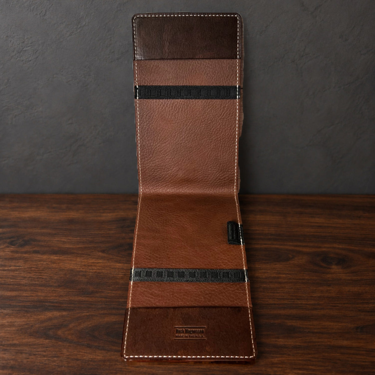 Inside the Oakmont Pro yardage book cover: whiskey interior, elastics at the top and bottom and a pencil loop