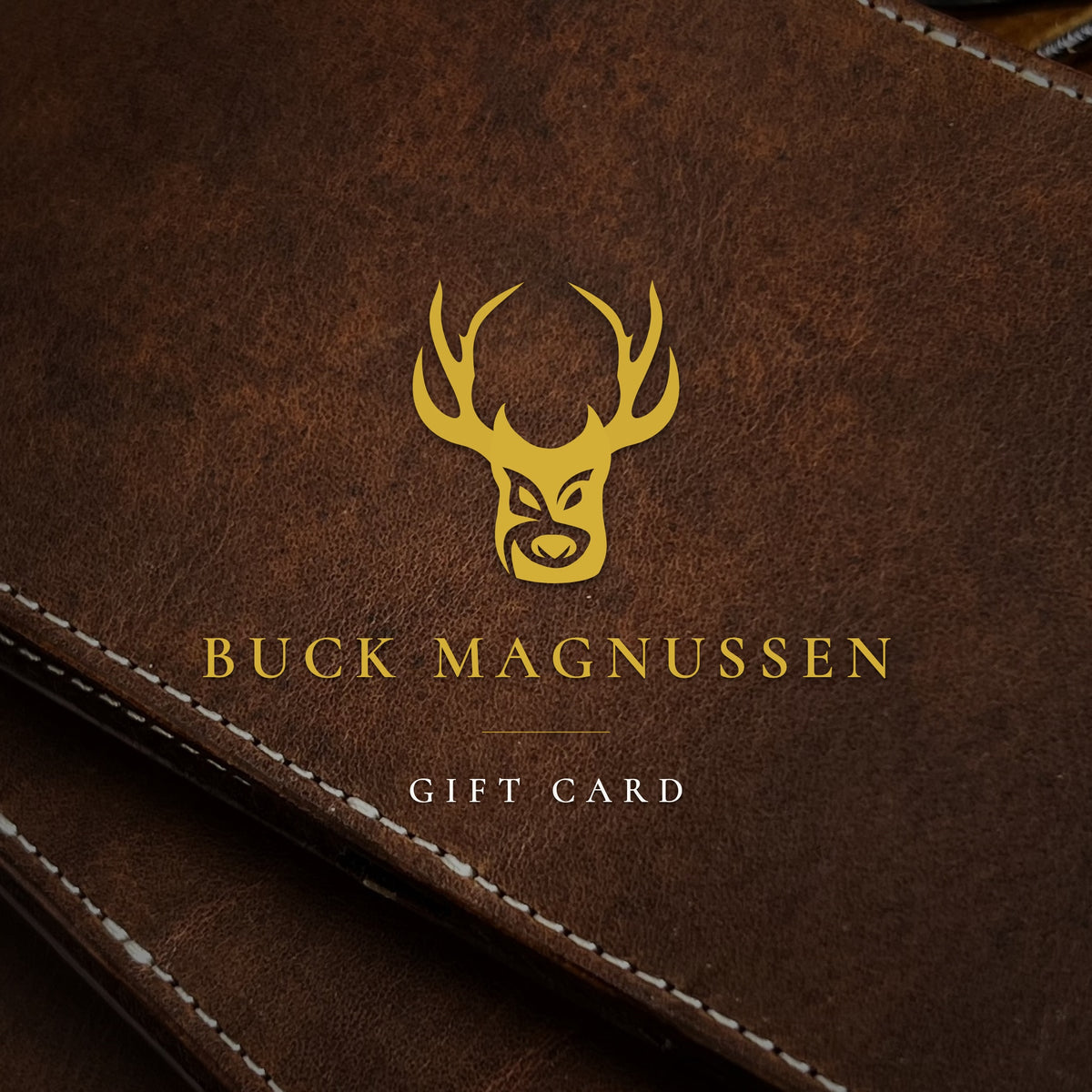 Buck Magnussen gift card: gold stag mark and wordmark on brown full-grain leather
